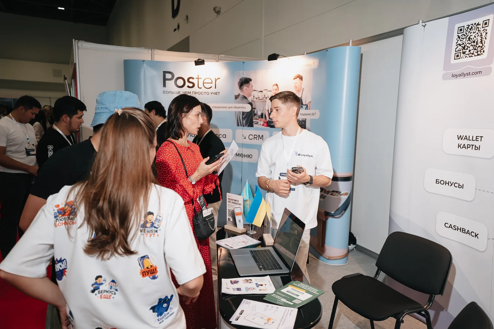 The Loyallyst team speaking with exhibition visitors