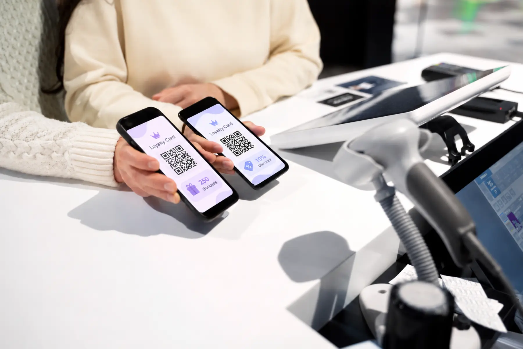 Customers show digital loyalty cards with QR codes at checkout