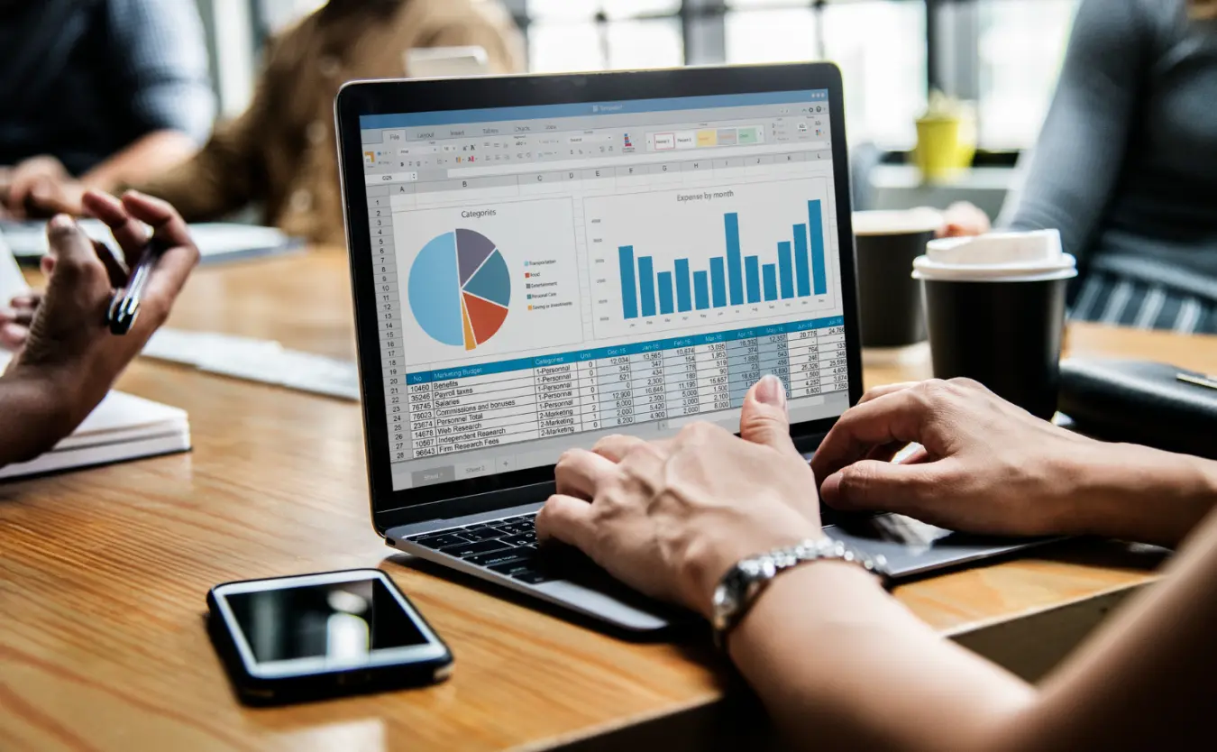 A team reviews sales data on a laptop
